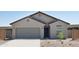 Charming single-story home with a two-car garage and low-maintenance desert landscaping at 5840 W Willow Ridge Dr, Laveen, AZ 85339