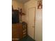 Bedroom with dresser, TV, and unpainted walls at 8022 E 1St Ave, Mesa, AZ 85208