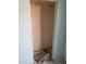 Empty closet with unfinished floor and dated paint at 8022 E 1St Ave, Mesa, AZ 85208
