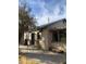 Exterior view of the home featuring large windows and a spacious patio area for entertaining at 8022 E 1St Ave, Mesa, AZ 85208