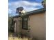 This one-story home appears to be abandoned; boarded up door at 8022 E 1St Ave, Mesa, AZ 85208