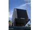 HVAC system mounted on the roof, set against a sunny sky with palm trees visible in the background at 8022 E 1St Ave, Mesa, AZ 85208