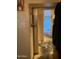 Hallway with limited lighting and peeling paint at 8022 E 1St Ave, Mesa, AZ 85208