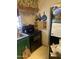 Kitchen featuring appliances, sink, and dated cabinets at 8022 E 1St Ave, Mesa, AZ 85208