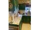 Kitchen with green cabinets and decorative backsplash at 8022 E 1St Ave, Mesa, AZ 85208