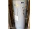 Whirlpool water heater is situated in a frame of wooden beams at 8022 E 1St Ave, Mesa, AZ 85208