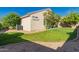Expansive backyard featuring thriving trees and a stone border at 8104 S 73Rd Dr, Laveen, AZ 85339