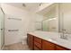 Clean bathroom features tile floor, spacious vanity and accessible shower at 8104 S 73Rd Dr, Laveen, AZ 85339