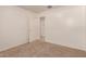 Cozy bedroom with plush carpet and a view leading to another room at 8104 S 73Rd Dr, Laveen, AZ 85339