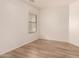 Neutral bedroom with plank flooring and a bright window at 8104 S 73Rd Dr, Laveen, AZ 85339
