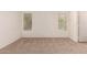 Neutral bedroom with carpeting, bright windows, and white walls at 8104 S 73Rd Dr, Laveen, AZ 85339