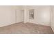 Unfurnished bedroom features neutral carpet, bright window and closet at 8104 S 73Rd Dr, Laveen, AZ 85339