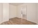 Unfurnished bedroom with plank flooring and neutral paint at 8104 S 73Rd Dr, Laveen, AZ 85339