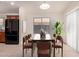 Staged dining area featuring table with seating for six, and natural light from the window at 8104 S 73Rd Dr, Laveen, AZ 85339