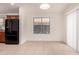 The breakfast nook has tile floors and lots of natural light from the window and sliding glass door at 8104 S 73Rd Dr, Laveen, AZ 85339