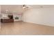 Bright, open living space with tile flooring and ceiling fan, ready for your personal touch at 8104 S 73Rd Dr, Laveen, AZ 85339