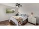 Relaxing bedroom featuring hardwood floors, bright natural light, and stylish contemporary furnishings at 8143 E Whitton Ave, Scottsdale, AZ 85251