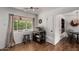 Kitchen nook featuring hardwood floors, a view to the back yard, and modern appliances at 8143 E Whitton Ave, Scottsdale, AZ 85251