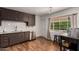 Functional kitchen featuring stainless steel appliances, white subway tiles, and wooden floors at 8143 E Whitton Ave, Scottsdale, AZ 85251