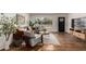 Comfortable living room featuring stylish furniture, natural light, hardwood floors, and a decorative rug at 8143 E Whitton Ave, Scottsdale, AZ 85251