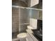 Bathroom featuring a modern sink, pebble stone tile floor in the shower, and a glass shower door at 8520 E Mackenzie Dr, Scottsdale, AZ 85251