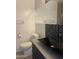 Bathroom featuring a toilet, modern sink, a glass shower door, and a mirrored cabinet at 8520 E Mackenzie Dr, Scottsdale, AZ 85251