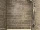 Tiled shower with rainfall showerhead, handheld sprayer and a modern gray tile surround at 8520 E Mackenzie Dr, Scottsdale, AZ 85251