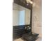 Bathroom featuring a black granite sink bowl, mosaic tile backsplash, and modern fixtures at 8520 E Mackenzie Dr, Scottsdale, AZ 85251