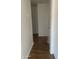 Bright hallway features hardwood floors, modern white walls, and access to multiple rooms at 8520 E Mackenzie Dr, Scottsdale, AZ 85251