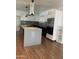 Modern kitchen features stainless steel appliances, a large center island, and light wood floors at 8520 E Mackenzie Dr, Scottsdale, AZ 85251