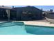 Inviting in-ground pool with a covered patio and lush backyard at 8520 E Mackenzie Dr, Scottsdale, AZ 85251