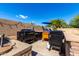 An outdoor kitchen and grill are ready for entertaining near the pool at 870 E Megan St, Gilbert, AZ 85295