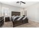 Comfortable bedroom featuring carpeted floors, neutral paint, and shuttered windows creating a cozy retreat at 870 E Megan St, Gilbert, AZ 85295