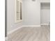 Bright bedroom featuring wood-look floors, neutral paint, and shuttered windows, creating a serene, welcoming space at 870 E Megan St, Gilbert, AZ 85295