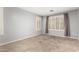 Neutral bedroom with carpet and shuttered windows allowing natural light to enter the room at 870 E Megan St, Gilbert, AZ 85295