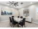 Elegant dining room featuring wood-look tile floors, modern lighting, and sophisticated decor at 870 E Megan St, Gilbert, AZ 85295