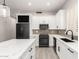 Modern kitchen featuring stainless steel appliances, ample counter space, and shaker-style cabinets at 870 E Megan St, Gilbert, AZ 85295