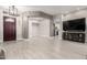 Open concept living room with tile floor, a dark door and recessed lighting at 870 E Megan St, Gilbert, AZ 85295
