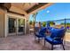 Outdoor patio area featuring blue patio furniture and a fence surrounding the pool at 870 E Megan St, Gilbert, AZ 85295