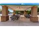 Covered picnic area with tables and benches, offering a shady spot for outdoor gatherings at 870 E Megan St, Gilbert, AZ 85295
