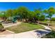 A scenic view of playground equipment and grassy area, perfect for outdoor fun and recreation at 870 E Megan St, Gilbert, AZ 85295