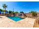 Refreshing backyard pool with clear blue water and desert landscaping at 870 E Megan St, Gilbert, AZ 85295