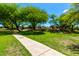 Picturesque walking path winds through lush landscaping, enhancing the neighborhood's appeal at 870 E Megan St, Gilbert, AZ 85295