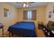 Bedroom with ceiling fan at 10308 E Osage Ave, Mesa, AZ 85212