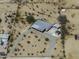 Spacious rural property with a manufactured home, large driveway, and multiple storage units at 10622 N Malachite Way, Casa Grande, AZ 85122