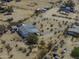 An aerial view of a single story home with desert landscaping and a circular driveway in a rural area at 10622 N Malachite Way, Casa Grande, AZ 85122