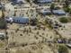 An aerial view of a single story home with desert landscaping and a circular driveway in a rural area at 10622 N Malachite Way, Casa Grande, AZ 85122