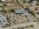 An aerial view of a single story home with desert landscaping and a circular driveway in a rural area at 10622 N Malachite Way, Casa Grande, AZ 85122