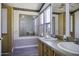 The bathroom features dual sinks, a vanity, and stylish decor, offering functionality and style at 10622 N Malachite Way, Casa Grande, AZ 85122