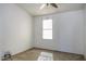 A standard bedroom with a ceiling fan, a single window, and carpeted floor at 10622 N Malachite Way, Casa Grande, AZ 85122